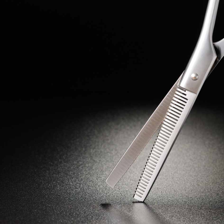 hair cutting scissors on black background We can provide a range of services and treatments at our hairdressers in dudley