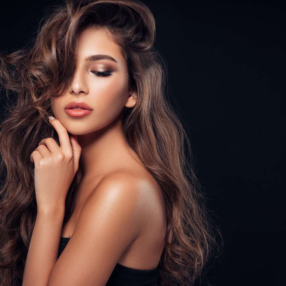 lady with long brown prom hair Choose Caprio's Hair Studio as a Prom hairstylist near me